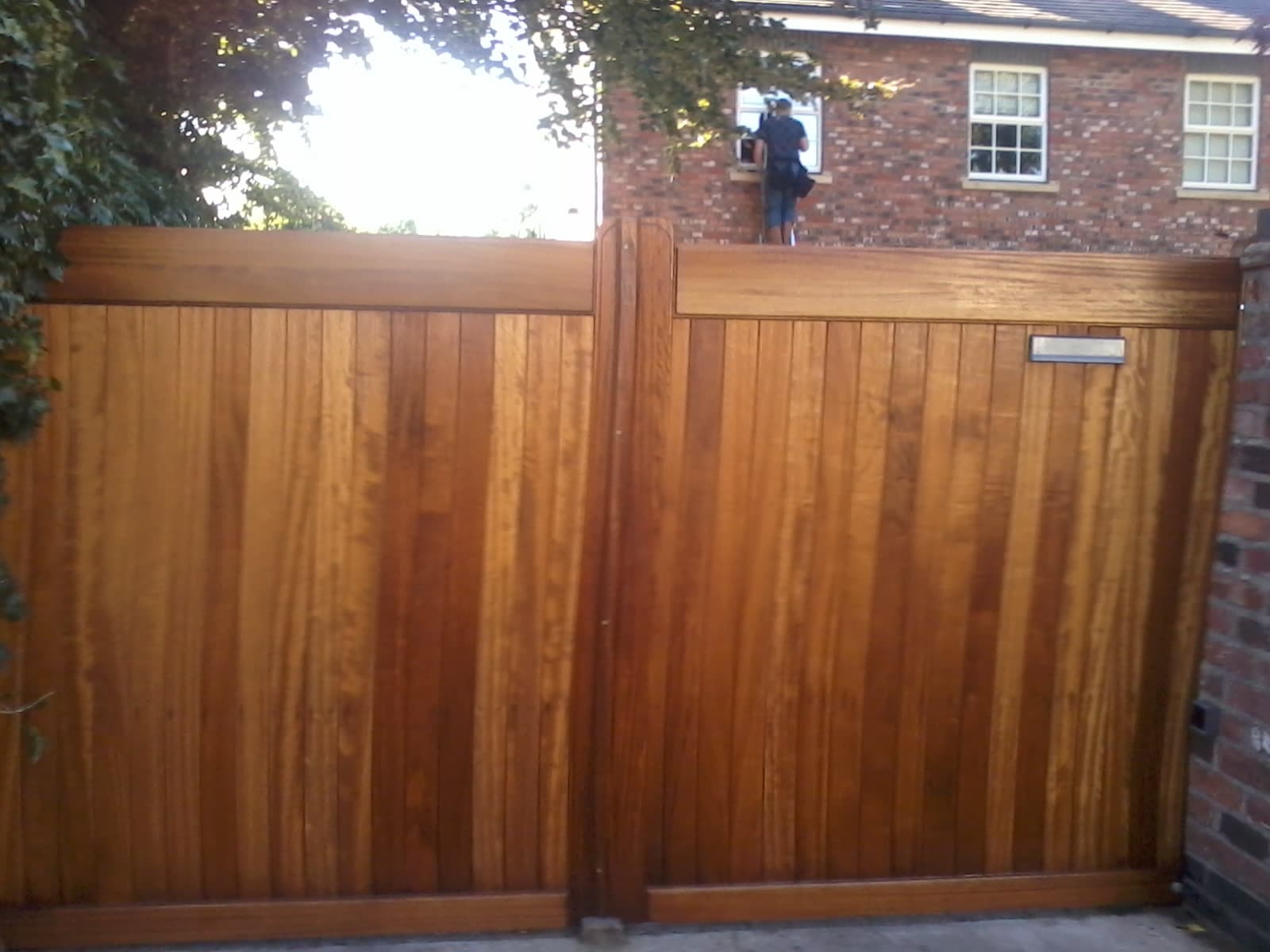 Hardwood Iroko gates with a flat top for the driveway – front