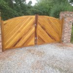 Bow Top Double Driveway Gates made from Iroko. Double sided with herringbone(diagonal) boarding