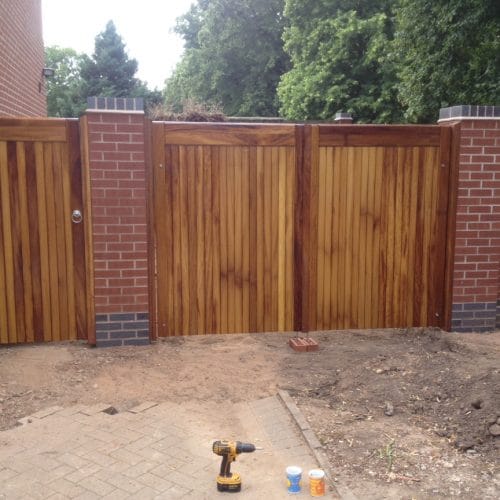 matching entrance and pedestrian gates made from iroko