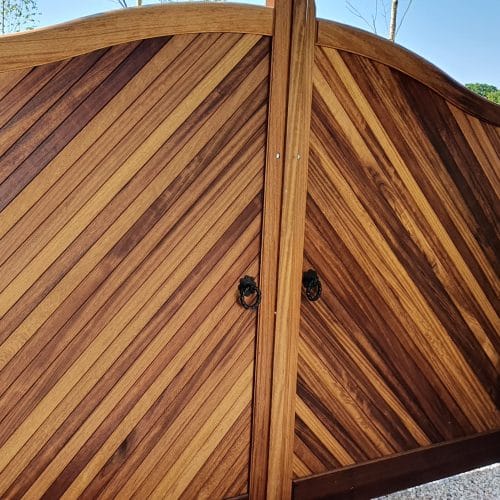 Electric gates made from iroko with diagonal boarding