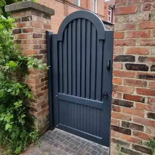 Garden painted gate using RAL7016 fitted between two brick piers with a coded lock.