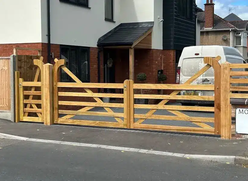Link to our range of 5 bar field gates and matching pedestrian gate showing a hardwood gate fitted between gate posts using silver galvanised hinges.