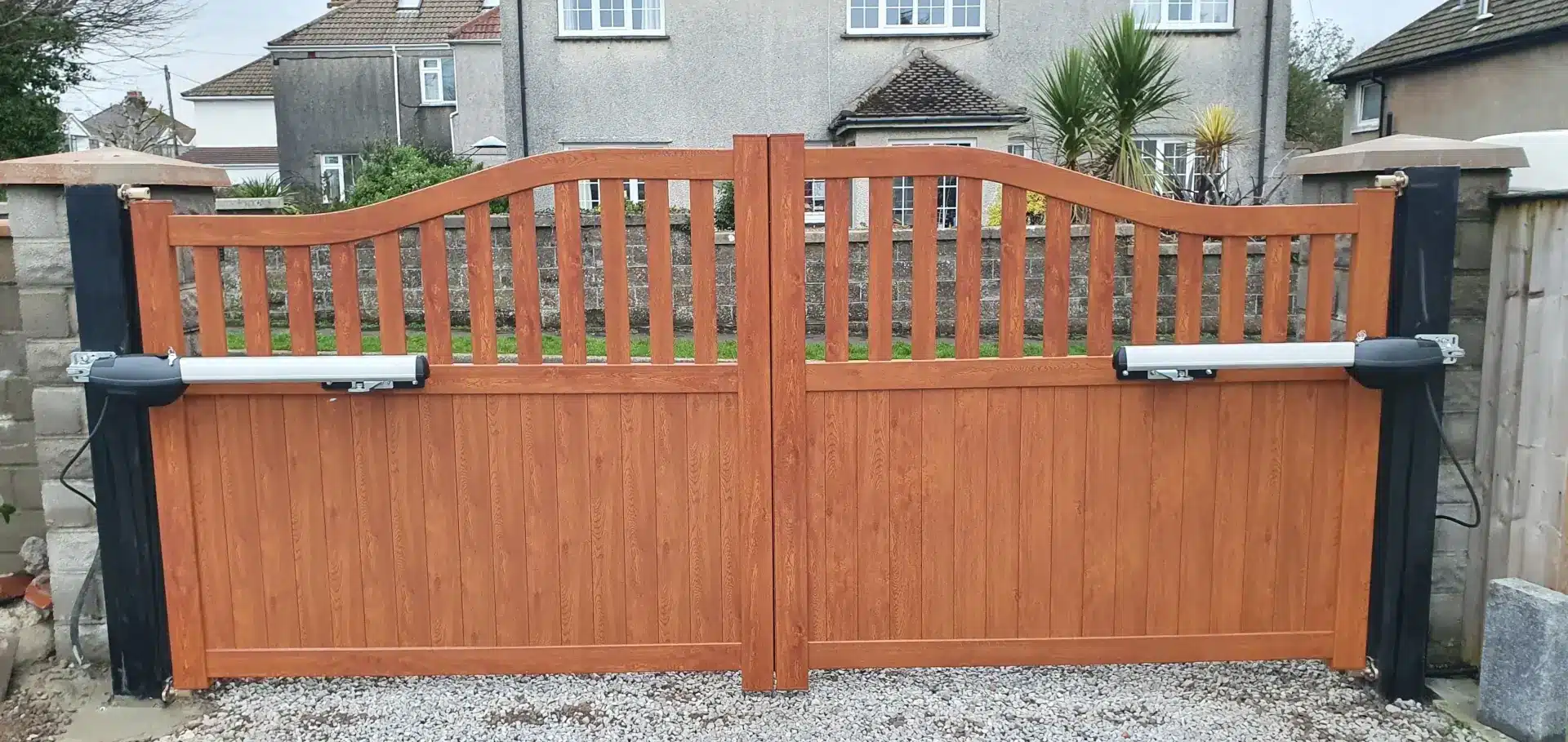 rear view of electric gates made from aluminium using aboveground gate automation